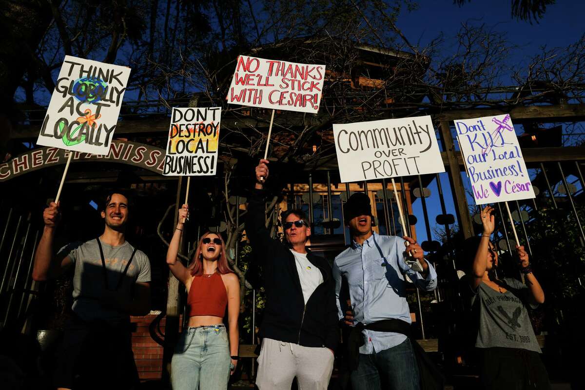From left to right: Iolua Albano, Kara Quinty, Michael Lewis, Chris Boas and Jordan Duzi protest the closure of Cèsar outside Chez Panisse on Tuesday, March 8, in Berkeley.