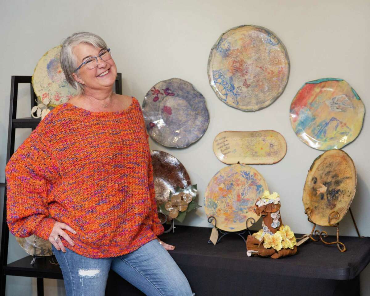 Artists Kimber Hardick and Ron Robare opened The Bella Bottega artist community in October at 903 Honea Egypt Road off FM 1488. There are currently seven resident artists in the artist community. Hardick is pictured with some of her finished pieces in their gallery room.