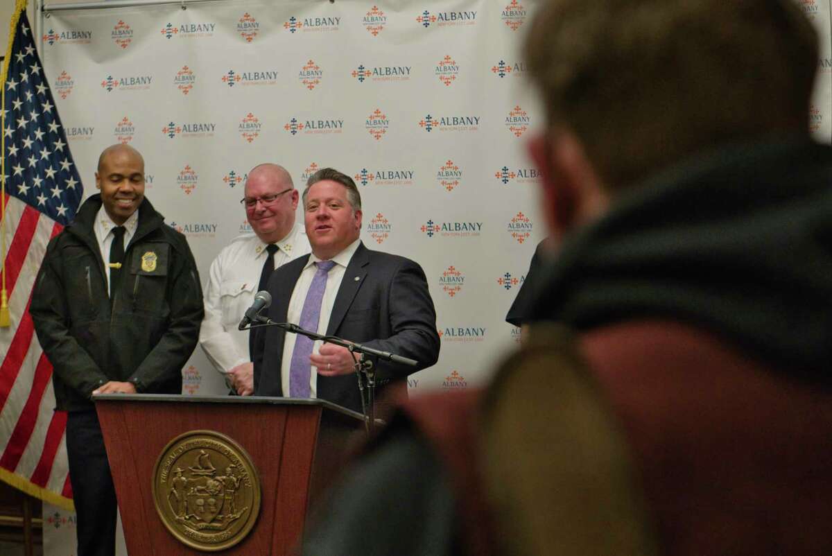 Albany Police Chief Eric Hawkins, left, and Albany Fire Chief Joseph Gregory, second from left, look on as Albany County Executive Dan McCoy speaks at a press conference held to talk about the upcoming St. Patrick?•s Day Parade, on Wednesday, March 9, 2022, in Albany, N.Y.