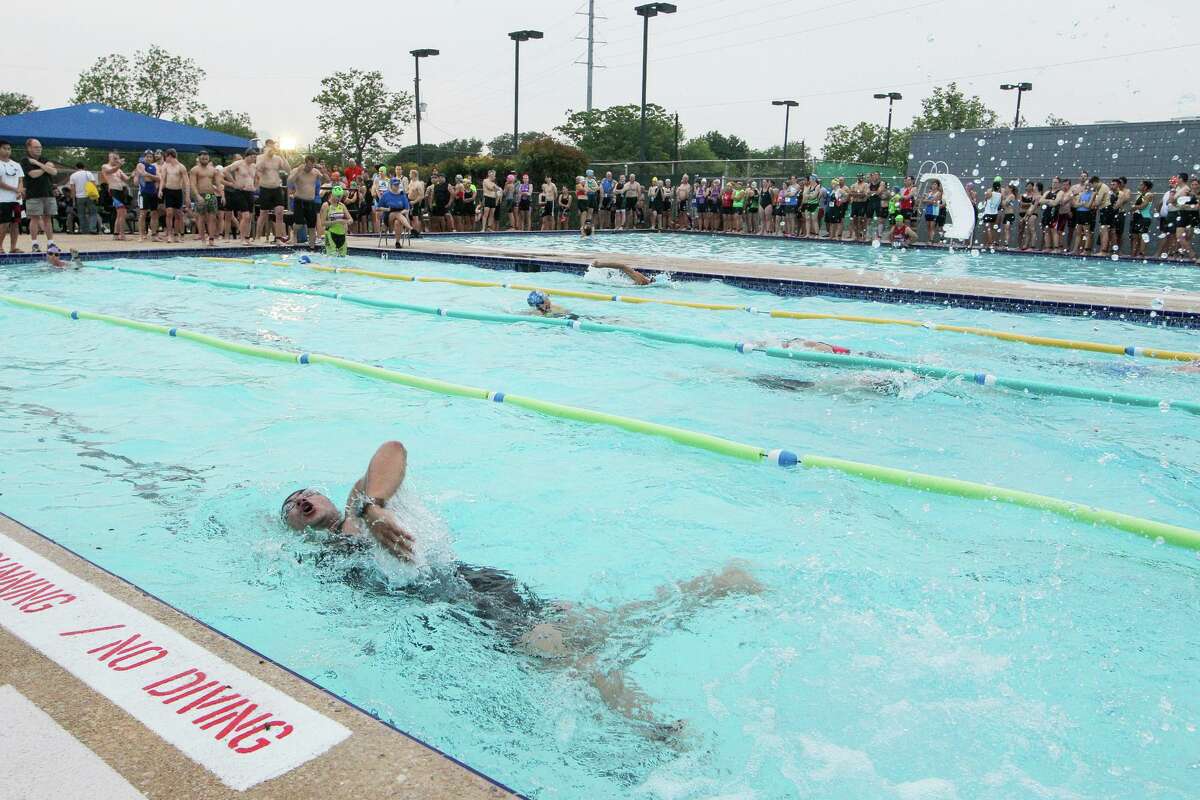 Triathlon particpants compete in the swimming segment in the Windcrest Pool as others wait their turn during the sixth annual Windcrest Freshman Triathlon on Saturday on April 26, 2014. Photo by Marvin Pfeiffer / EN Communities