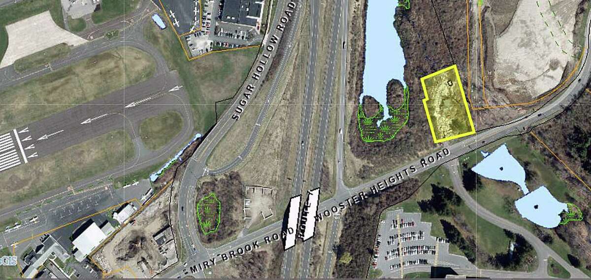 A long-blighted property at 89 Wooster Heights Road in Danbury (in yellow). Danbury Municipal Airport is to the west. Danbury has a court-ordered plan to clean up the property.