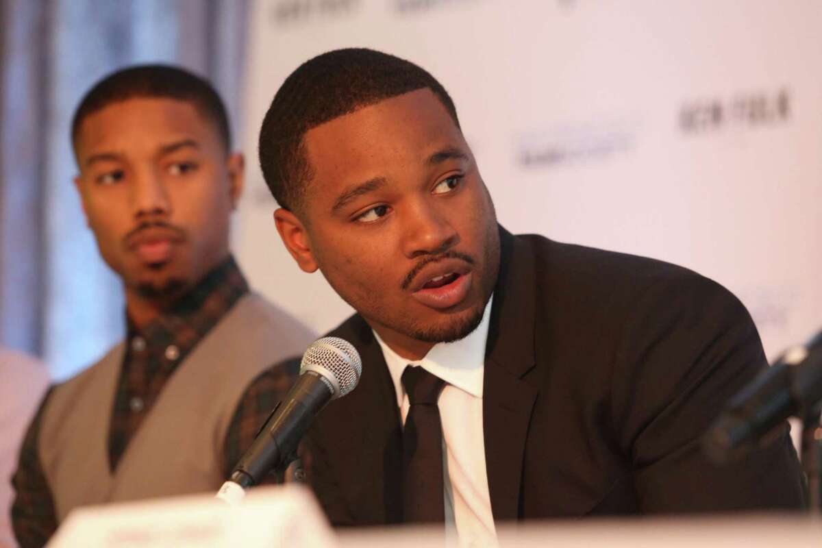 Filmmaker Ryan Coogler, director of “Fruitvale Station” and “Black Panther,” answers a question as actor Michael B. Jordan listens at a news conference at the San Francisco Film Society's Inaugural Fall Celebration in San Francisco, Calif. on Thursday, Nov. 14, 2013.