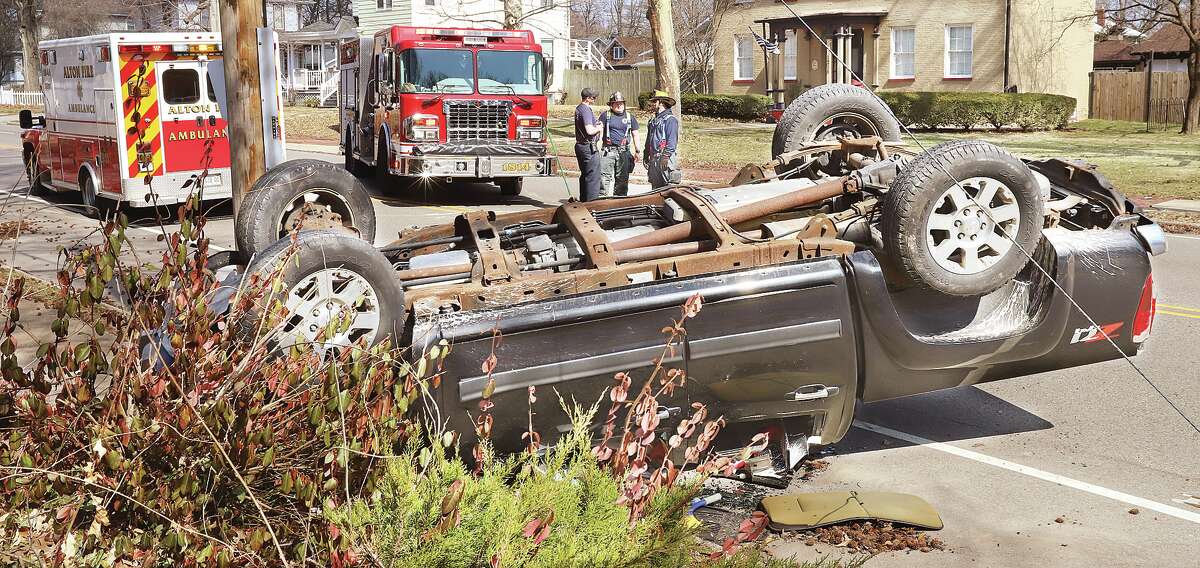 John Badman|The Telegraph Alton firefighters and police responded to the 1200 block of Washington Avenue in Alton about 12:25 p.m. Wednesday after a male driver lost control of his Chevrolet Colorado pickup truck on a curve near East Elementary School. The driver ended up flipping the truck onto its top. Alton firefighters treated the man in one of their ambulances at the scene. Because of the curve in the road, Alton Police had Washington Avenue closed completely in both directions for a time Wednesday. The roadway was opened in time for school dismissal.