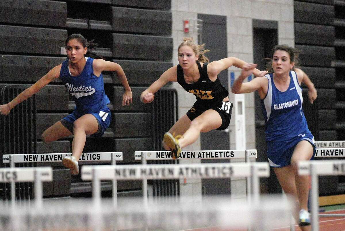 Amity’s Allison Barwise, center, compete in the 55-meter hurdles in 2009.