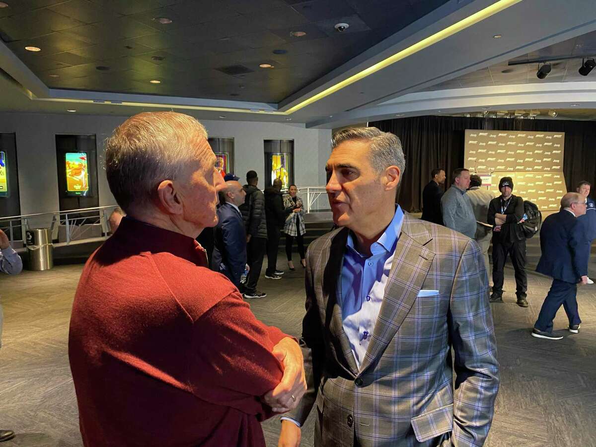 Former UConn coach Jim Calhoun, left, chats with fellow Naismith Basketball Hall of Famer Jay Wright at Madison Square Garden.