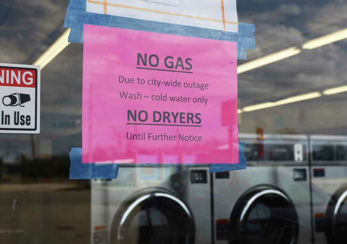 A sign at a laundromat in Seguin tells customers that it has no gas to run the dryers. The city of Seguin is dealing with a natural gas outage that could last for days.