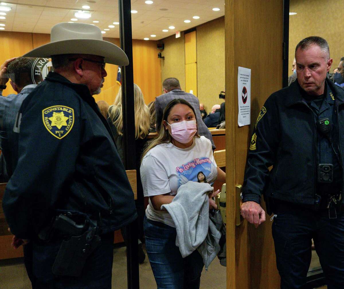 Abigail Alvarez Solis, center, exits the Harris County Commissioners Court after speaking to the county’s bail bond board, which is considering the recommendation to require that bonding companies collect a minimum 10 percent of bail before posting a surety bond, on Wednesday, March 9, 2022, in Houston.