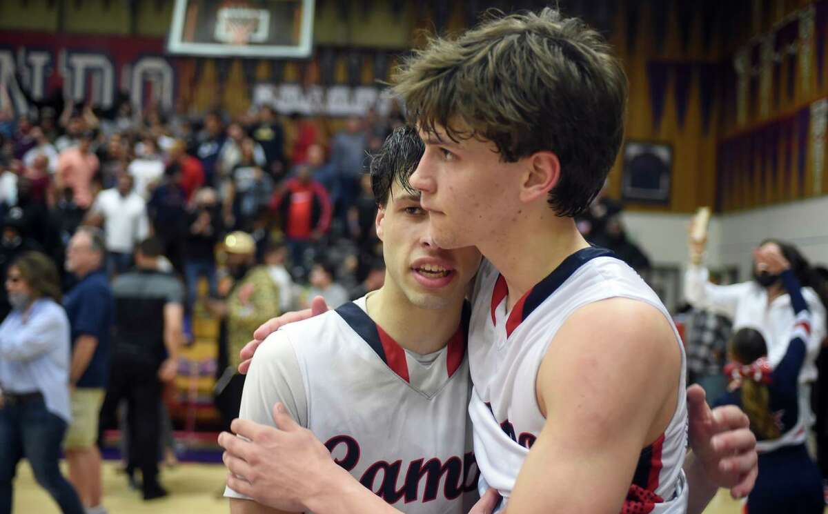 Campolindo’s Cade Bennett (left) and Aidan Mahaney embrace after the Cougars’ 56-53 loss to Modesto Christian in Tuesday night’s NorCal Open Division championship game.