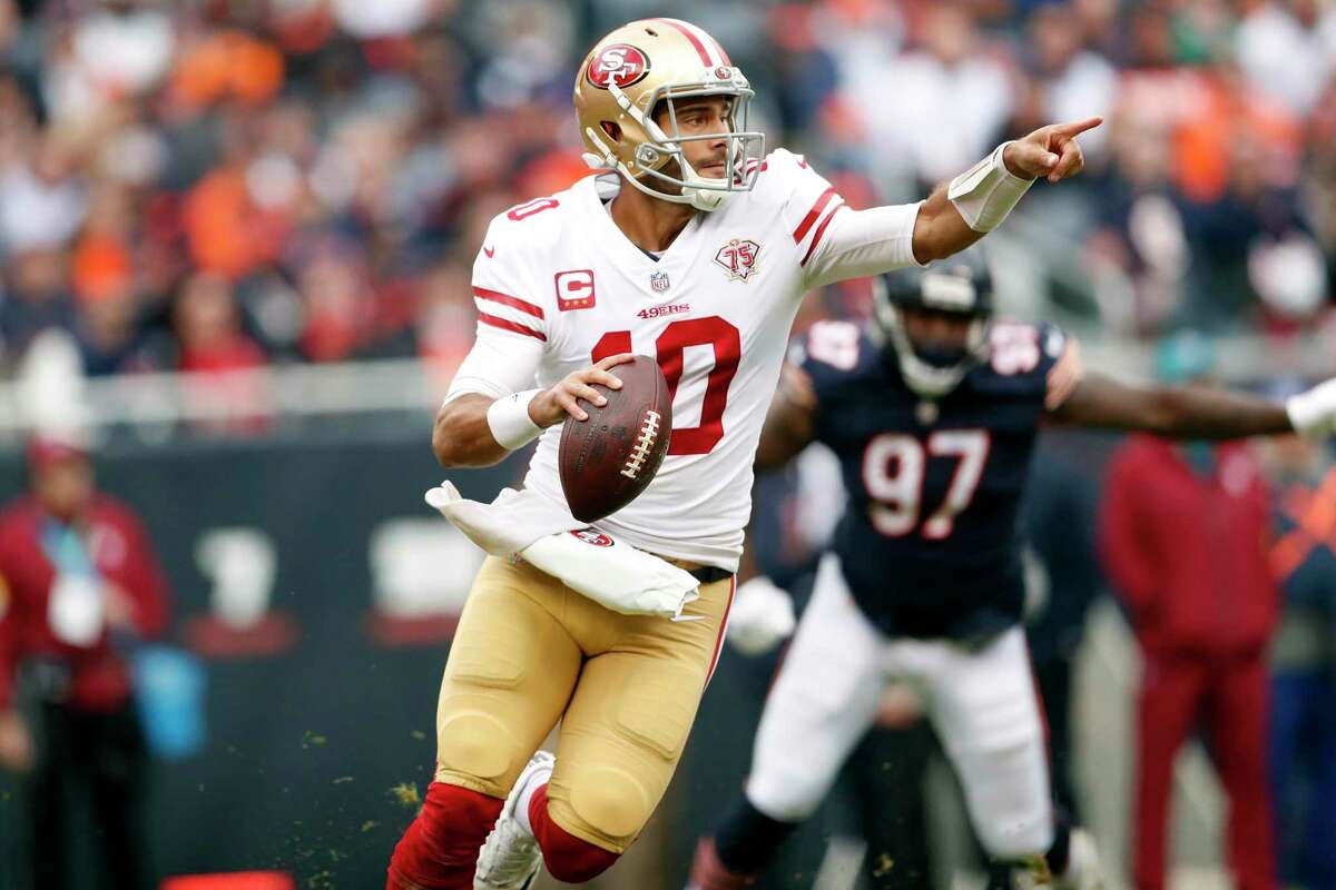 San Francisco 49ers QB Jimmy Garoppolo rolls out during the Niners' 33-22 Oct. 31 win over the Bears in Chicago.