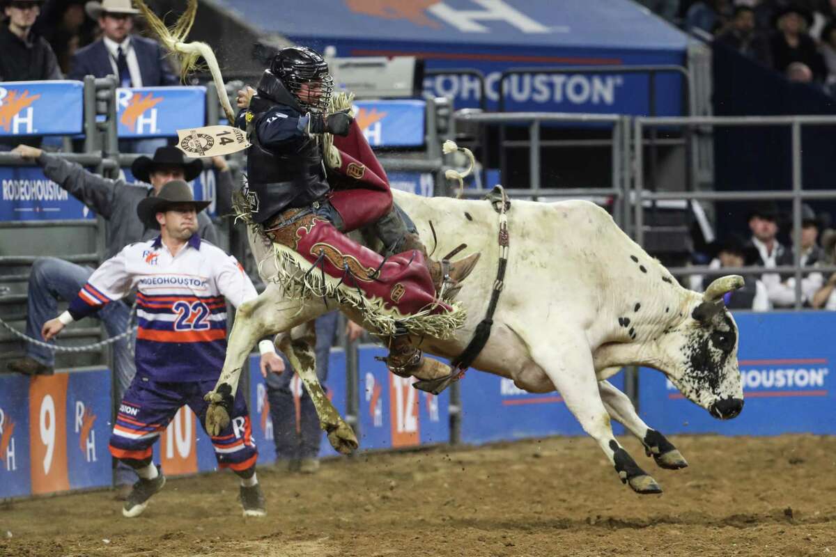 Trey Benton is thrown by Floating Fury during bull riding during Super Series IV, Round 1, at Rodeo Houston Wednesday, March 9, 2022 in Houston.