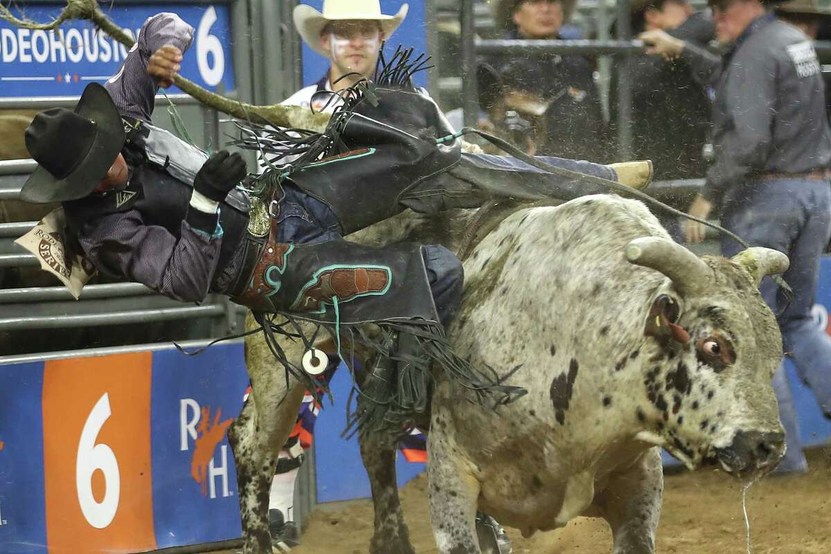 Laramie Mosley is bucked off by Dances with Monsters during bull riding during Super Series IV, Round 1, at Rodeo Houston Wednesday, March 9, 2022 in Houston.