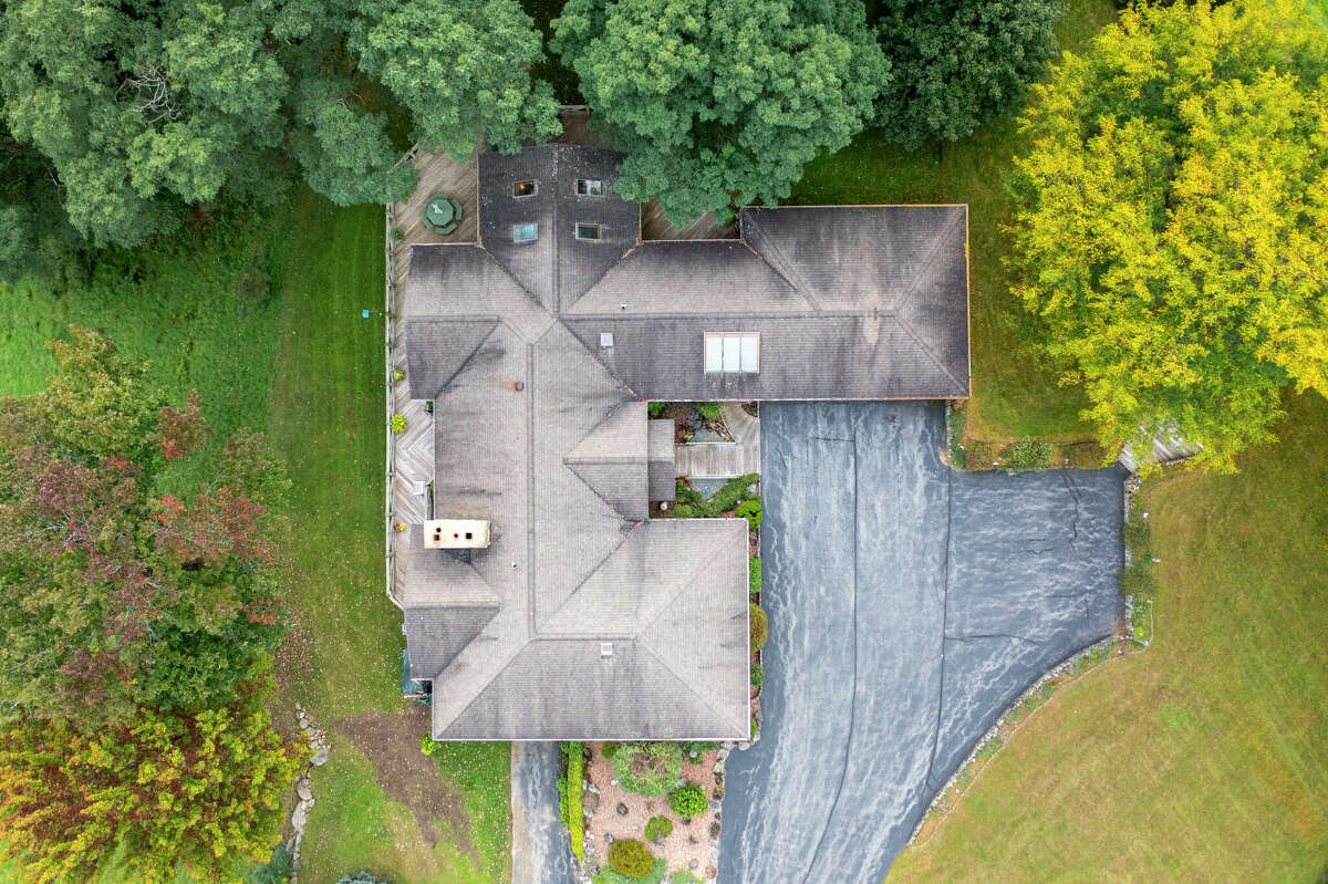 This week’s house was built into a hillside along 1139 Middleline Road in Milton, which created a beautiful view from the deck and single-story living at the same time. Some of the 1990s interiors may need a makeover, but the natural elements used in the design are timeless. Exterior interest includes a bridge over a water feature at the front door. The house has four bedrooms and four bathrooms — one bedroom and bathroom are part of an in-law suite. The house has an open layout, a heated, three-car garage, two fireplaces and sits on a 14-acre-lot. Built in 1991, the house has 4,239 square feet of living space. Ballston Spa schools. Taxes: Approximately $8,000. List price: $975,000. Contact listing agent Karan Murray with Roohan Realty at 518-312-0723.