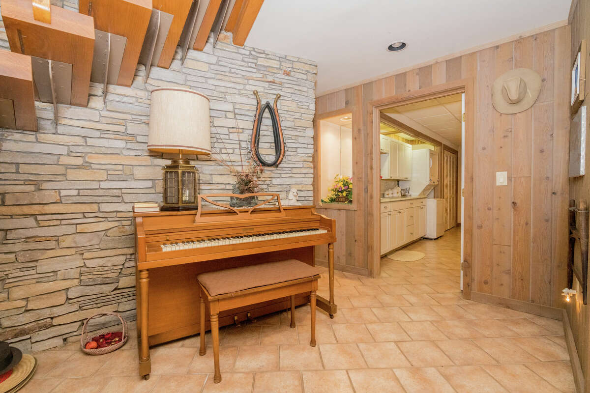 This week’s house was built into a hillside along 1139 Middleline Road in Milton, which created a beautiful view from the deck and single-story living at the same time. Some of the 1990s interiors may need a makeover, but the natural elements used in the design are timeless. Exterior interest includes a bridge over a water feature at the front door. The house has four bedrooms and four bathrooms — one bedroom and bathroom are part of an in-law suite. The house has an open layout, a heated, three-car garage, two fireplaces and sits on a 14-acre-lot. Built in 1991, the house has 4,239 square feet of living space. Ballston Spa schools. Taxes: Approximately $8,000. List price: $975,000. Contact listing agent Karan Murray with Roohan Realty at 518-312-0723.