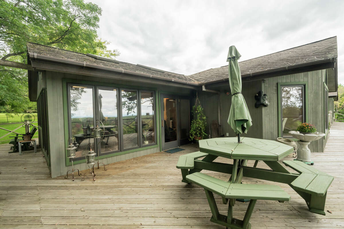 This week’s house was built into a hillside along 1139 Middleline Road in Milton, which created a beautiful view from the deck and single-story living at the same time. Some of the 1990s interiors may need a makeover, but the natural elements used in the design are timeless. Exterior interest includes a bridge over a water feature at the front door. The house has four bedrooms and four bathrooms — one bedroom and bathroom are part of an in-law suite. The house has an open layout, a heated, three-car garage, two fireplaces and sits on a 14-acre-lot. Built in 1991, the house has 4,239 square feet of living space. Ballston Spa schools. Taxes: Approximately $8,000. List price: $975,000. Contact listing agent Karan Murray with Roohan Realty at 518-312-0723.