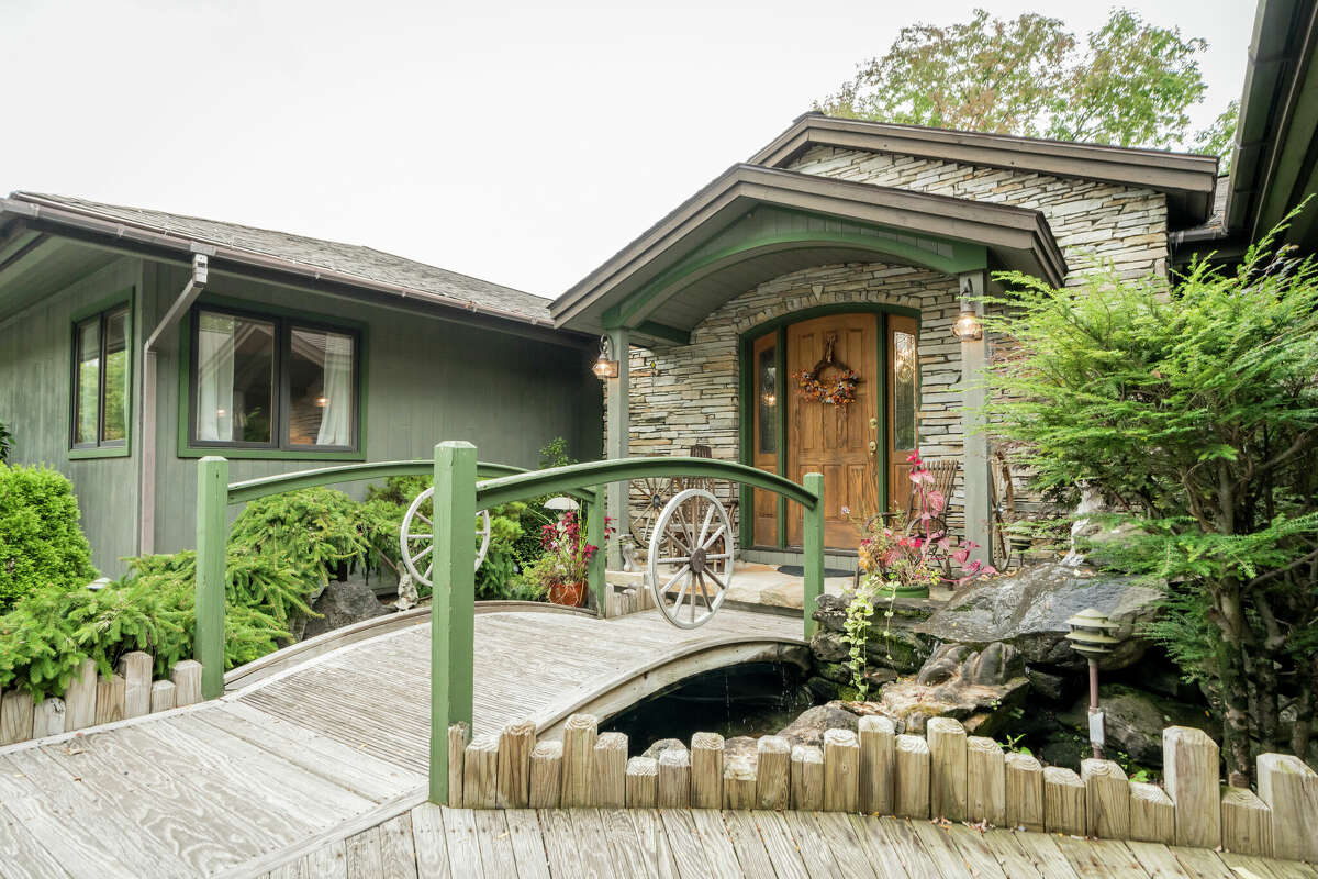 This week’s house was built into a hillside along 1139 Middleline Road in Milton, which created a beautiful view from the deck and single-story living at the same time. Some of the 1990s interiors may need a makeover, but the natural elements used in the design are timeless. Exterior interest includes a bridge over a water feature at the front door. The house has four bedrooms and four bathrooms — one bedroom and bathroom are part of an in-law suite. The house has an open layout, a heated, three-car garage, two fireplaces and sits on a 14-acre-lot. Built in 1991, the house has 4,239 square feet of living space. Ballston Spa schools. Taxes: Approximately $8,000. List price: $975,000. Contact listing agent Karan Murray with Roohan Realty at 518-312-0723.