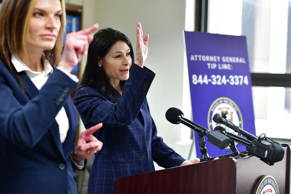 Michigan Attorney General Dana Nessel announces charges against Mark Chapman, a former Boy Scout troop leader, on Wednesday, March 9, 2022, in Detroit. Chapman, 51, is accused of sexually assaulting two boys at the time he was a scoutmaster in the Detroit suburb of Roseville, where he also worked in and attended The Church of Jesus Christ of Latter-day Saints. The charge stem from the state's review of child sexual abuse lawsuits against the Boy Scouts of America. 