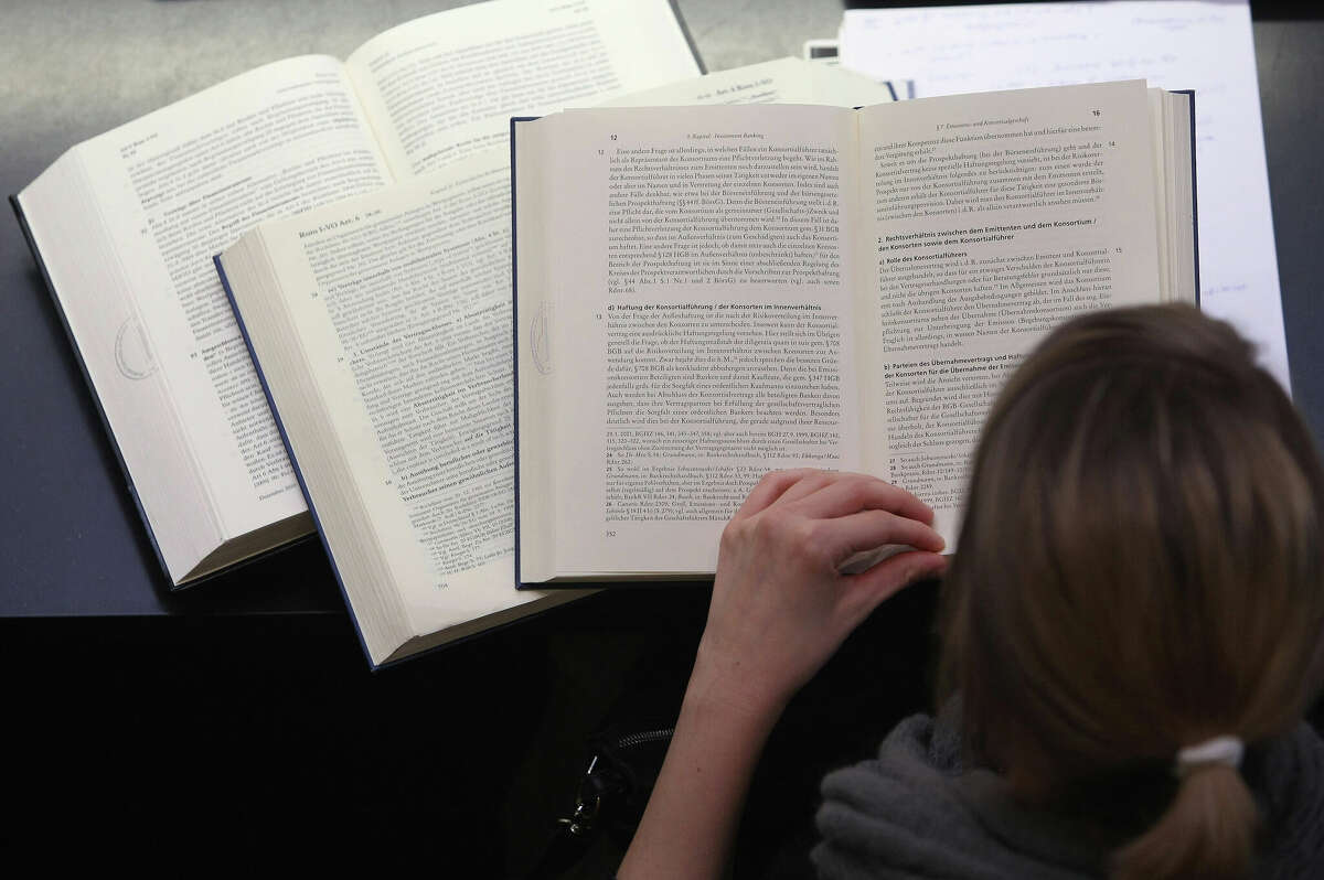 A student studies legal textbooks in the law faculty at Humboldt University in Berlin, Germany.
