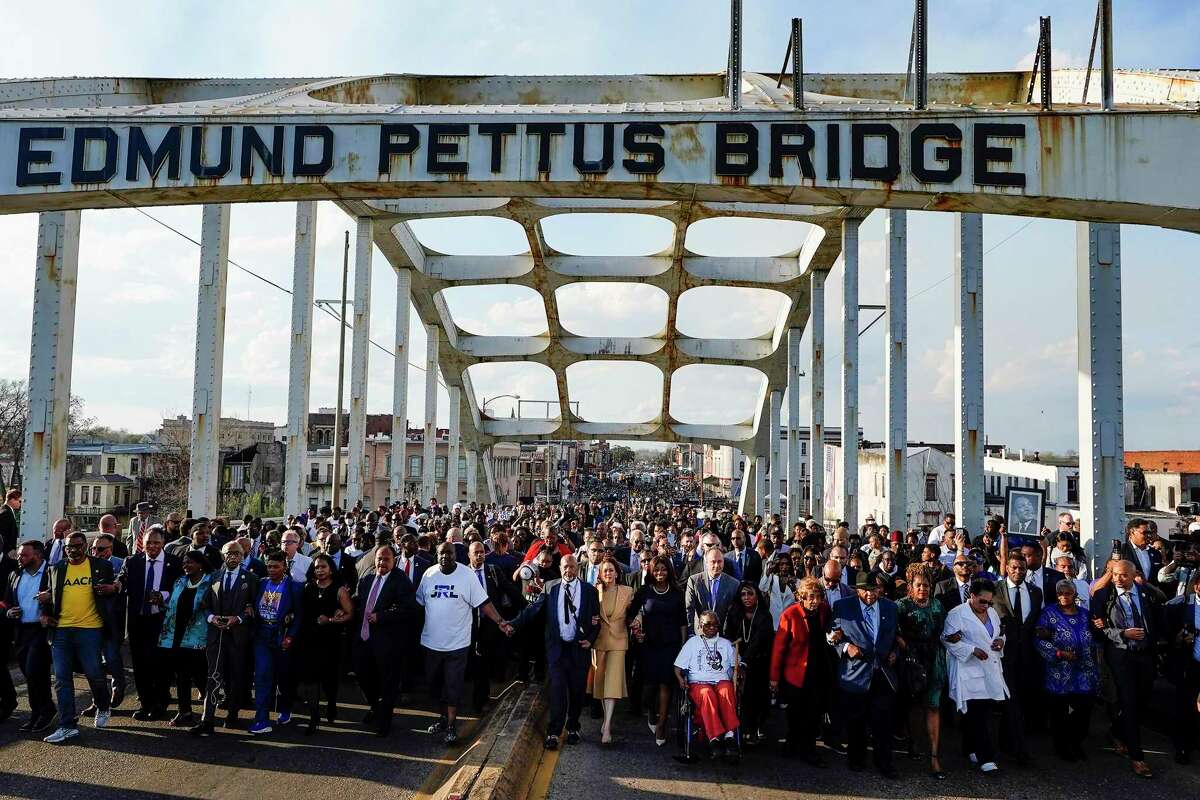 A crowd crosses the Edmund Pettus Bridge in Selma, Ala., on the anniversary of Bloody Sunday. “Progress is always a movement,” says U.S. Rep. James Clyburn, D-S.C. “You can’t stand still.”