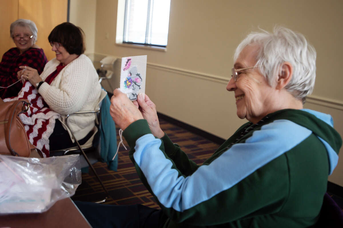 Barb Tucker of Auburn and Ruth Rowden of Auburn works on a project during a gathering of a needleworks group Wednesday, March 9, 2022 at the Auburn Area Branch Library.