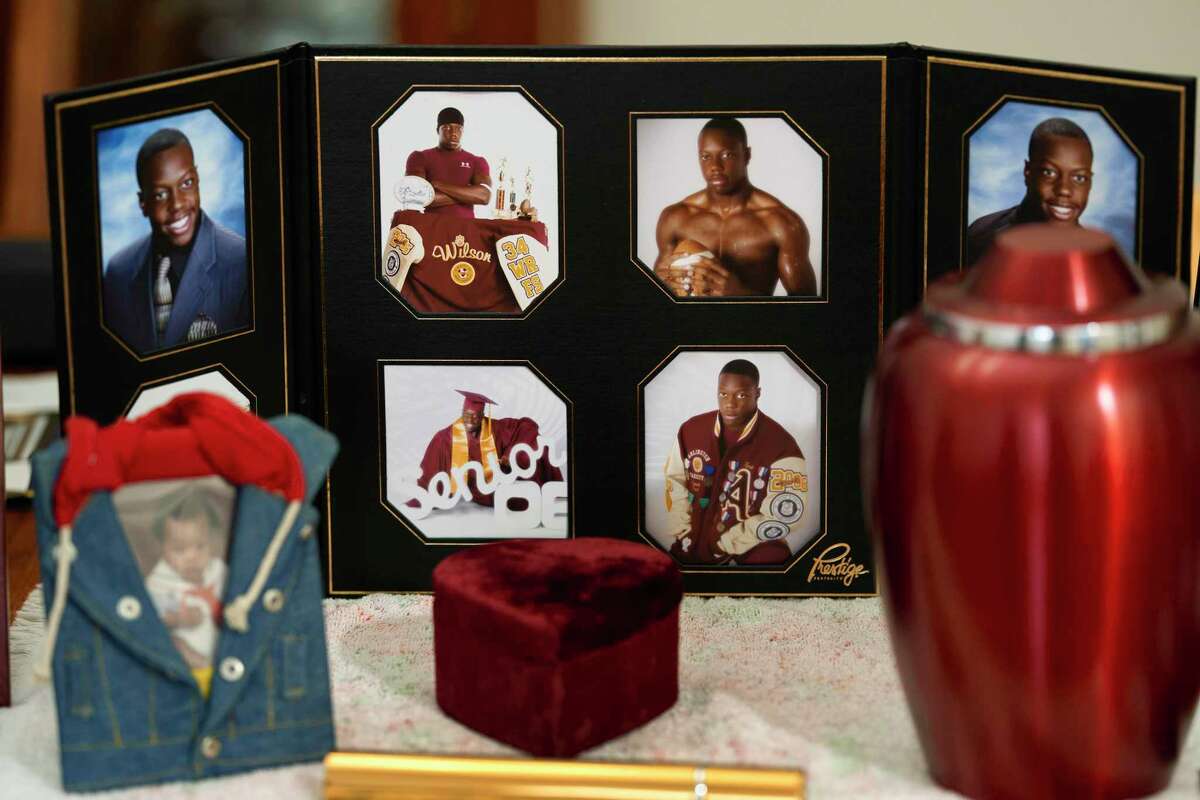 Photos of Tyrell Wilson and the urn with his ashes are displayed at the home of his father, Marvin Wilson, in Fort Worth, Texas.