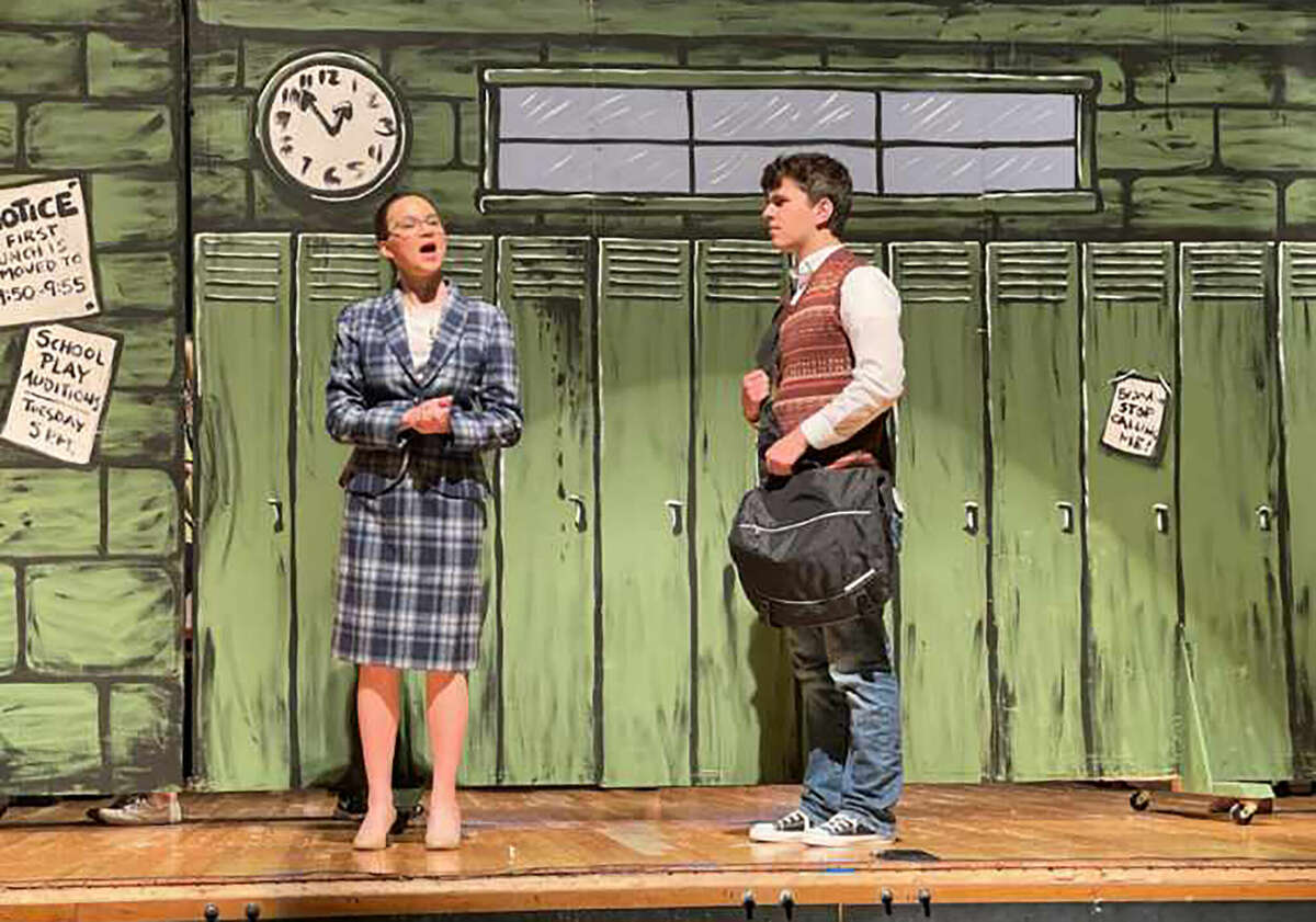 Katherine Ott (left) as Ms. Mullins and Gabe Karr as Dewey rehearse a scene from Jacksonville High School's production of "School of Rock". Jacksonville Middle School students also make up the cast.