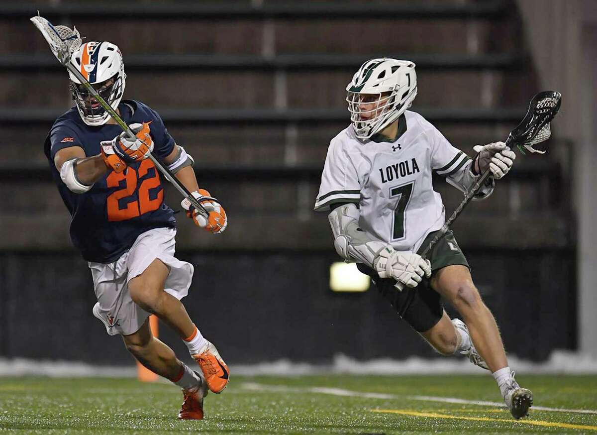 Darien’s Kevin Lindley (7), of the Loyola-Maryland men’s lacrosse team, in action against Virginia during a game in 2021.