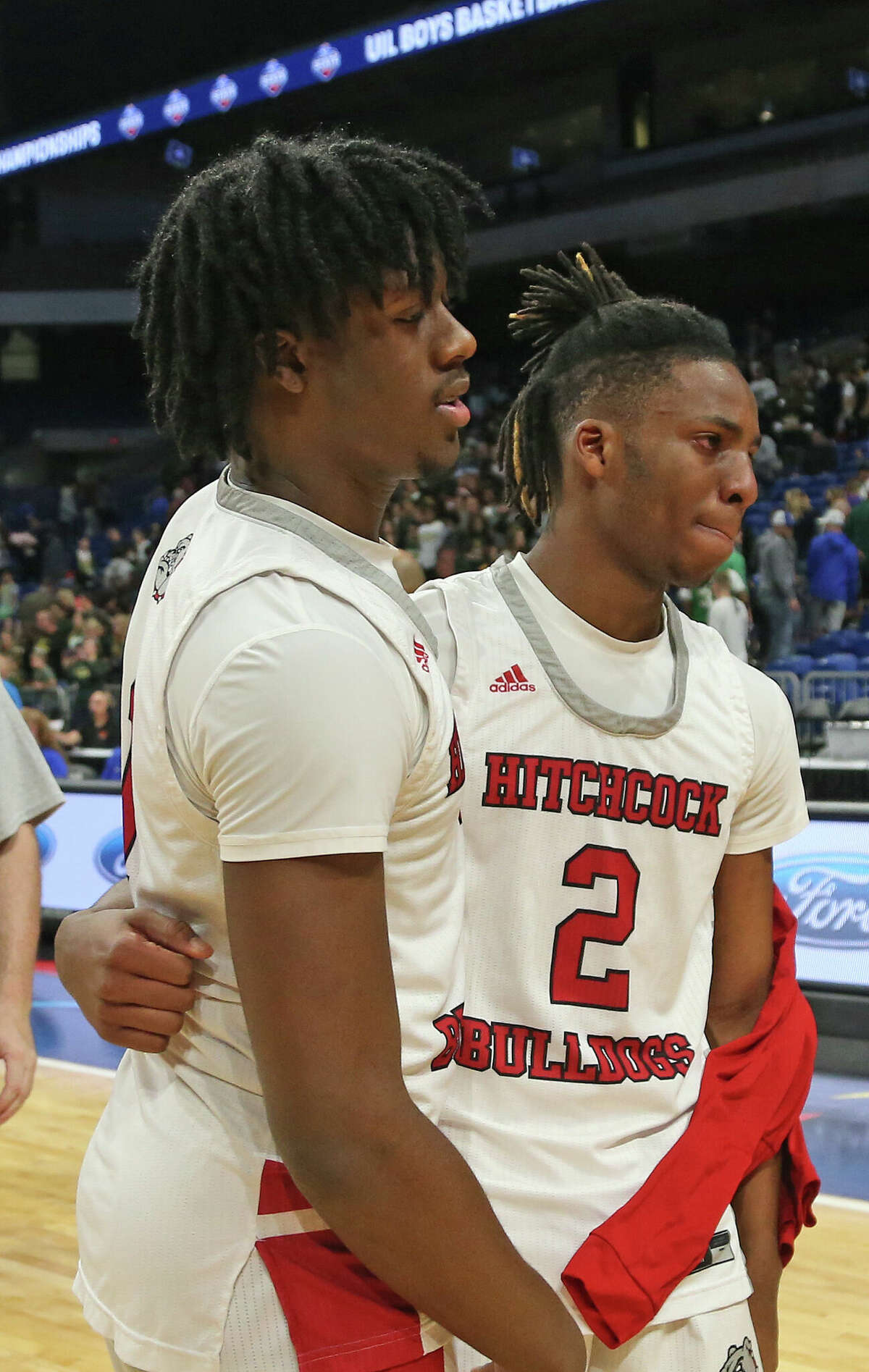 Hitchock guard Christian Dorsey (1) and guard Damien McDaniel (2) walk off the court. In UIL state boys basketball tournament Class 3A semifinal San Antonio Cole defeated Hitchock 53-49 on Thursday, March 10, 2022 at the Alamodome.