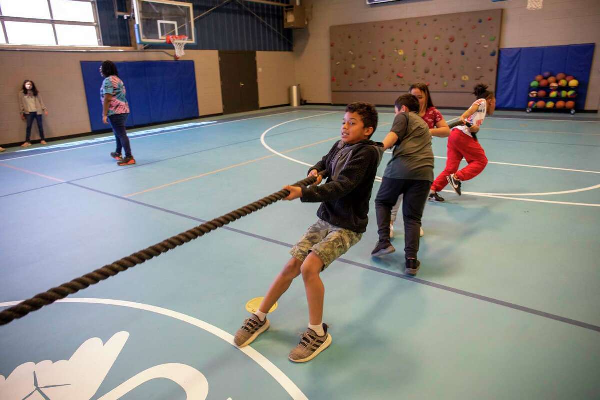 Kids play tug of war during the Parks and Recreation MLK Adventures Spring Break Camp on Thursday, March 10, 2022 at the Martin Luther King Jr. Community Center. Jacy Lewis/Reporter-Telegram
