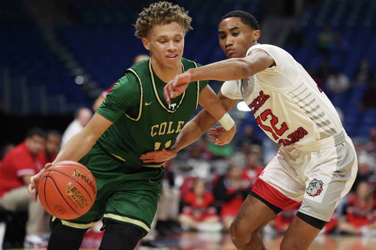 Cole Cougars' Trey Blackmore gets around Hitchcock Bulldogs' A'Aderius Blanks during the second half of the Class 3A State Semifinals at the Alamodome, Thursday, March 10, 2022. Cole won, 53-49 and moves on to the final game against Dallas Madison on Saturday.