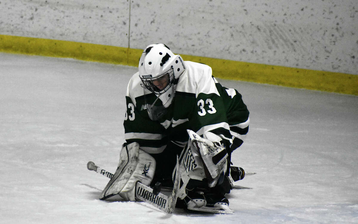 New Milford goalie Jonas Veleas makes a save during the CIAC Division III quarterfinals ice game between BBD and New Milford at Wonderland of Ice, Bridgeport on Thursdsay, March 10, 2022.