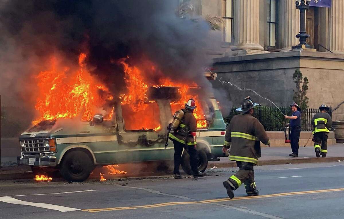 Firefighters respond to a vehicle fire at the corner of 5th and Mission in San Francisco on Thursday March 10, 2022.