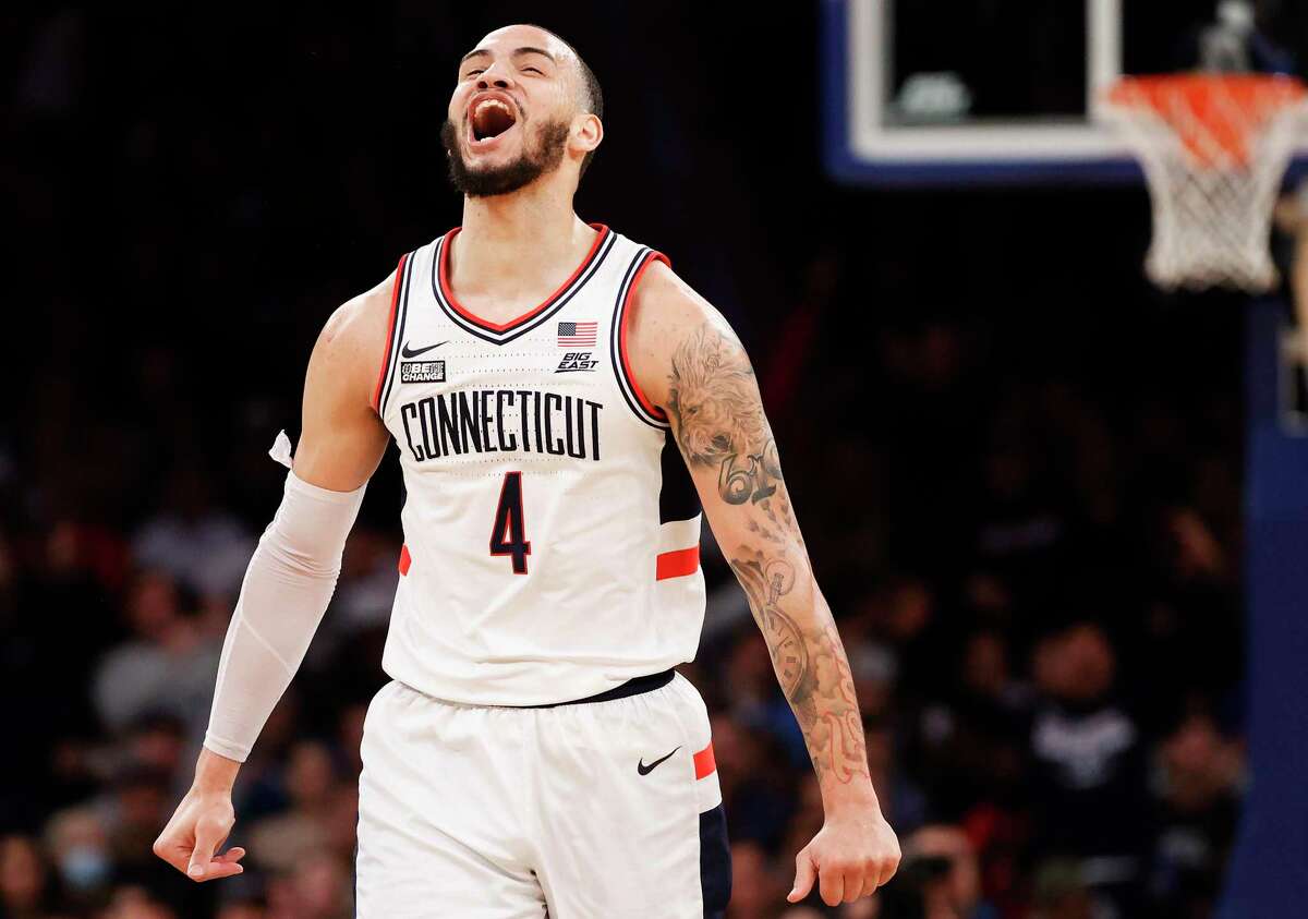 NEW YORK, NEW YORK - MARCH 10: Tyrese Martin #4 of the Connecticut Huskies reacts in the first half against the Seton Hall Pirates during the 2022 Big East Tournament at Madison Square Garden on March 10, 2022 in New York City. (Photo by Tim Nwachukwu/Getty Images)