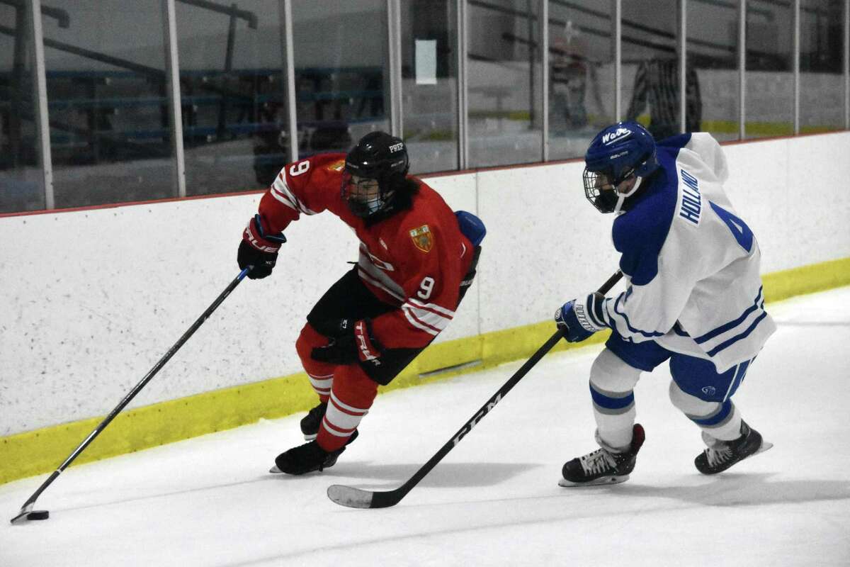 Fairfield Prep’s Aksel Sather skates with the puck against Darien at the Darien Ice House on Saturday, February 13, 2021.