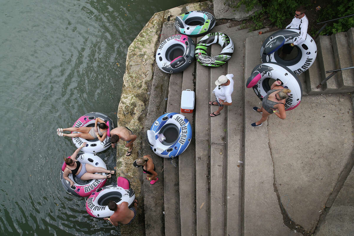Tubers launch into the Guadalupe River at a public access site off Texas FM 308 in Canyon Lake, Texas, Tuesday, June 30, 2020. 