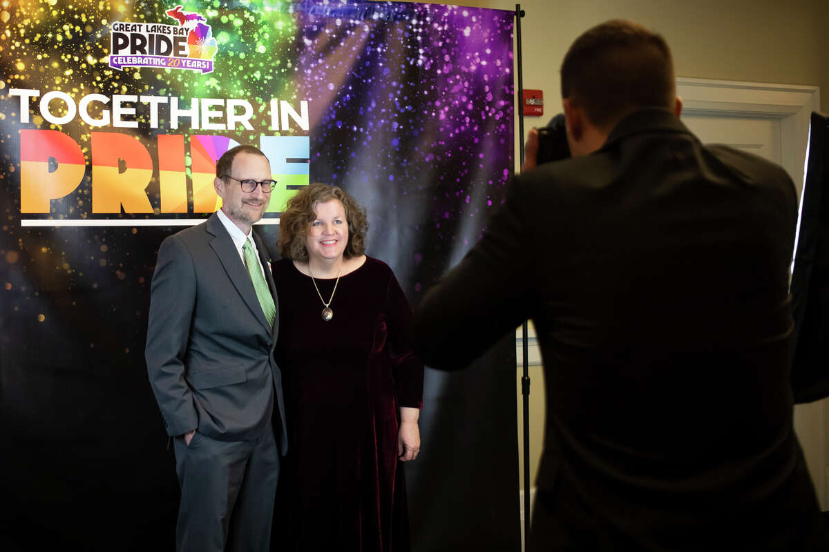 Guests enjoy dinner, drinks and a live auction during Great Lakes Bay Pride's Together in Pride fundraiser event Thursday, March 10, 2022 at the Midland Country Club.