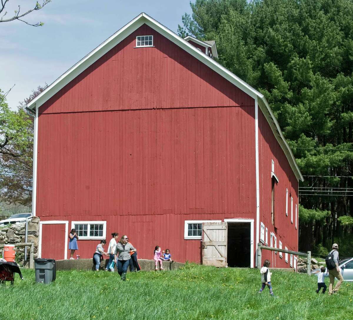 Families tour the barn at Smyrski Farm in New Milford as part of the After School Arts Program in Washington, partnering with Weantinoge Heritage Land Trust. Saturday, May 5, 2018