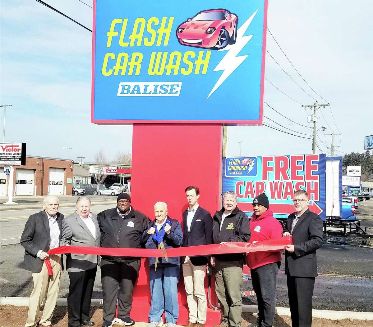 Newly opened Flash Car Wash in Middletown held a ribbon cutting Thursday. From left are Middlesex Chamber of Commerce President Larry McHugh, chamber past chairman Jay Polke, general manager Dwight Reed, owner Victor Rook, Mayor Ben Florsheim, Director of Car Wash Operations Jim Eszterhai, site manager Danny Ward and Chamber Cromwell Division Chairman Rodney Bitgood.