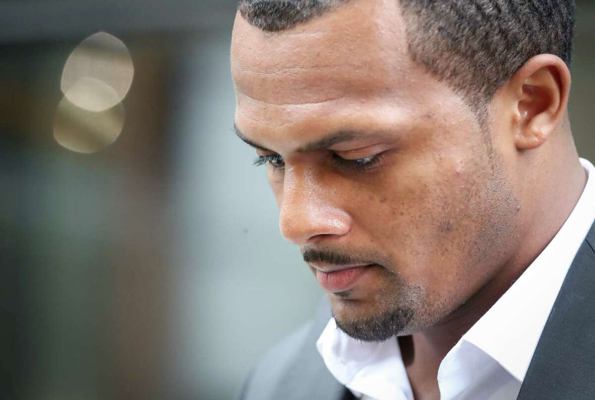 Houston Texans quarterback Deshaun Watson speaks to reporters with his attorney Rusty Hardin after a grand jury declined to indict him on criminal charges Friday, March 11, 2022, in Houston.