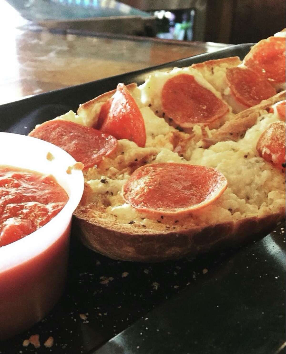 Dairy/egg-free pizza and garlic pepperoni cheese bread from Mellow Mushroom. 