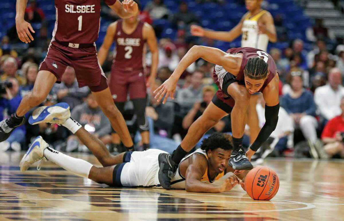 Silsbee guard Jerrick Harper (5) steals the ball from Oak Cliff Faith Family Academy guard Jazz Henderson (3) late in fourth quarter. Faith Family defeated Silsbee 70-62 in boys state semifinal on Friday, March 11, 2022.