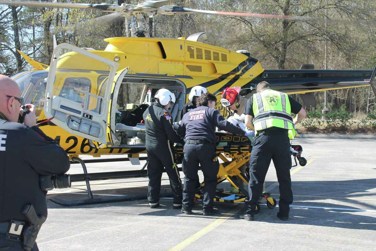 Emergency personnel load a patient onto a PHI Aviation helicopter as it prepares to do a medical air lift as part of the Shattered Dreams event held at Atascocita High School March 10. The re-enactment addresses drunk and distracted driving with teens.