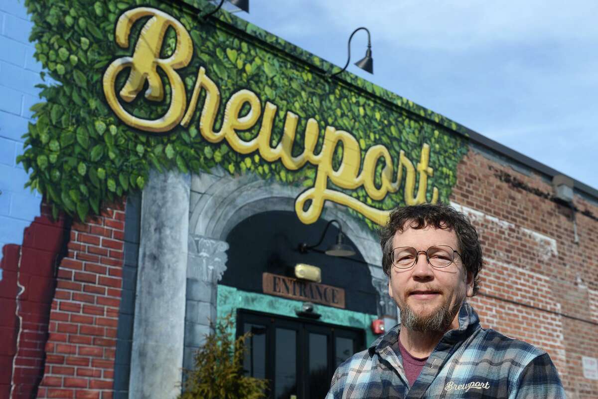 Brewmaster and senior partner Jeff Browning poses in front of Brewport Brewing Company, in Bridgeport, Conn. March 10, 2022.