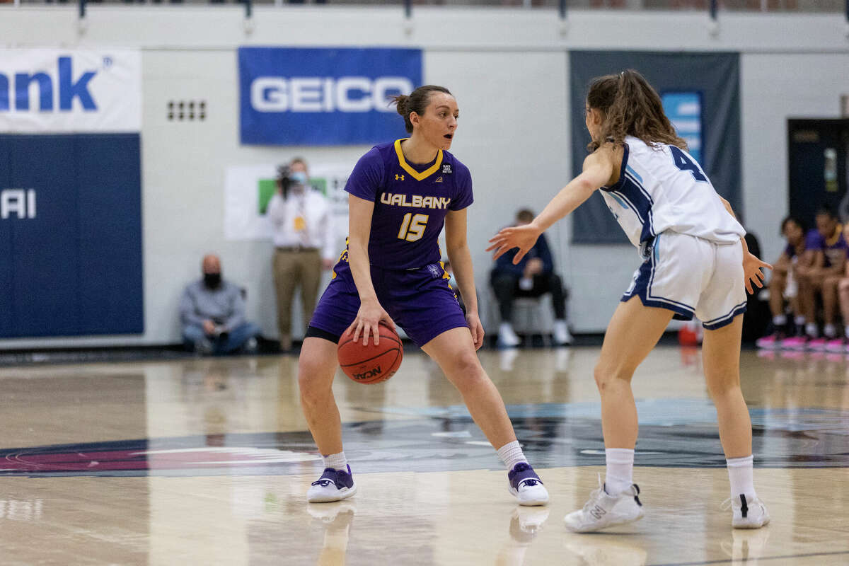 UAlbany guard Morgan Haney dribbles against Maine's Alba Orois in the America East championship game in Orono, Maine, on Friday, March 11, 2022. Haney led all scorers with 20 points.