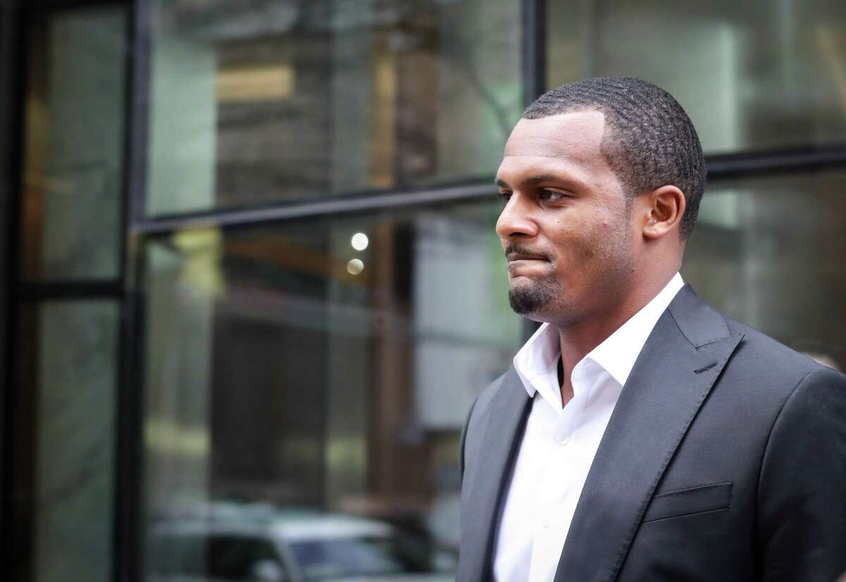 Houston Texans quarterback Deshaun Watson speaks to reporters with his attorney Rusty Hardin after a grand jury declined to indict him on criminal charges Friday, March 11, 2022, in Houston.