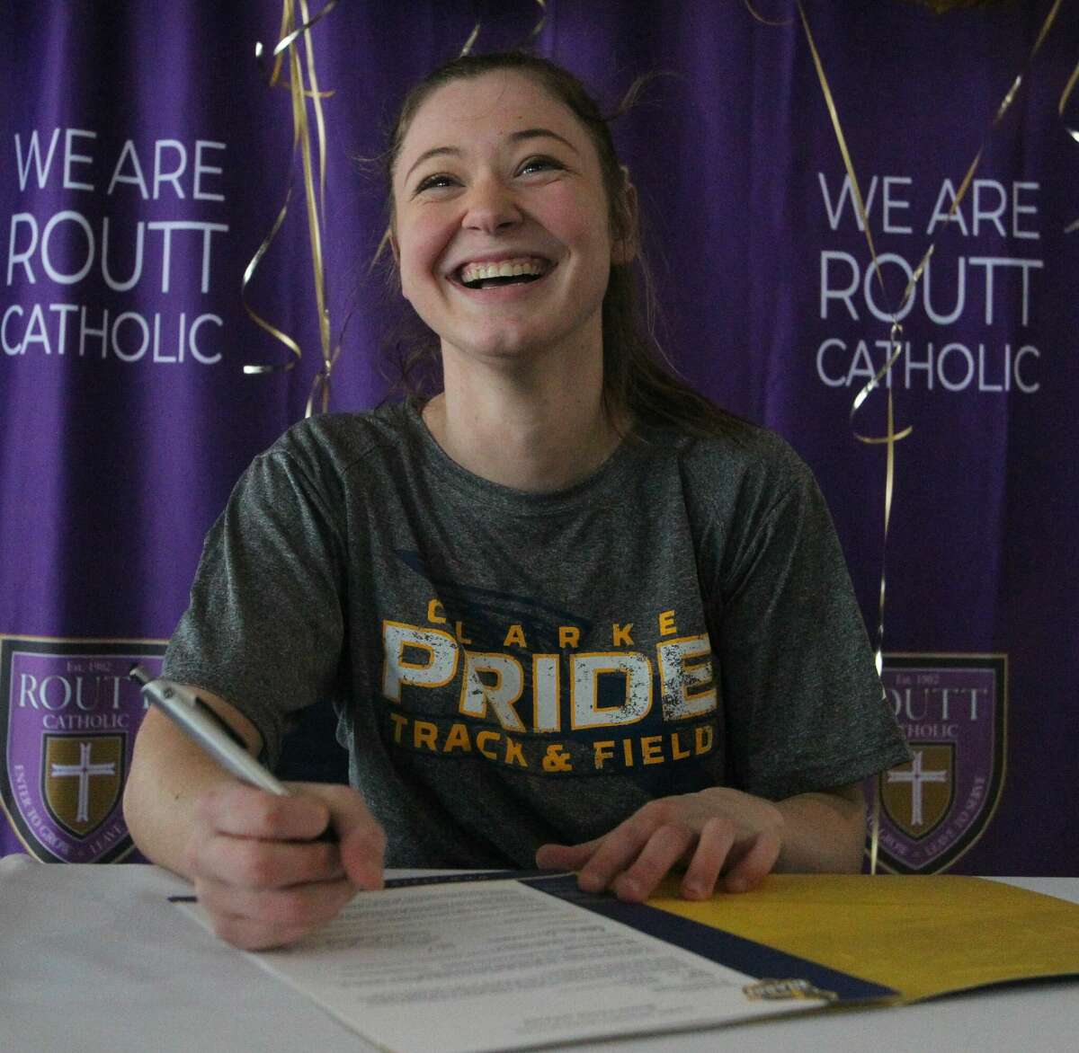 Emma Terwische smiles during a signing ceremony earlier this month at Routt Catholic High School.