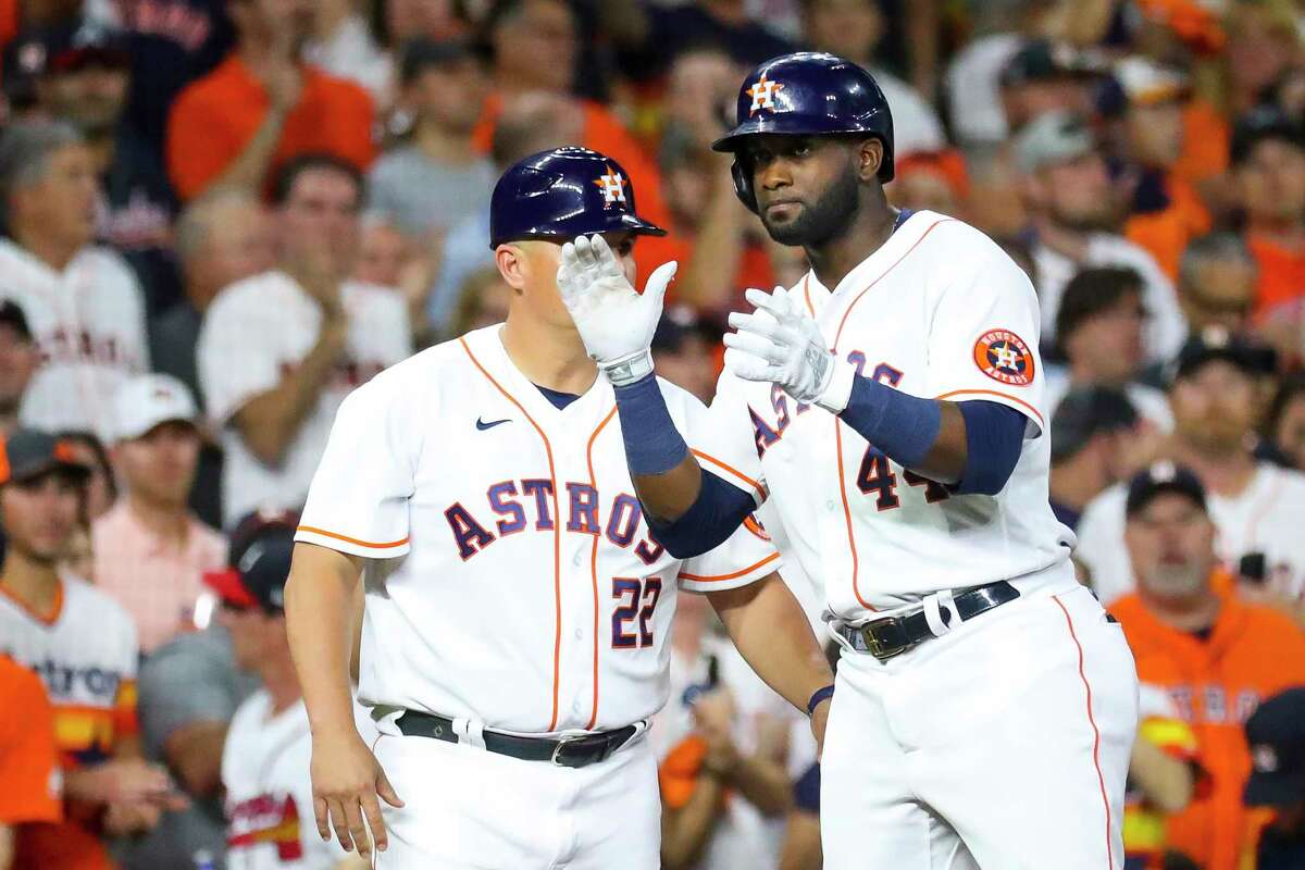 Houston Astros designated hitter Yordan Alvarez (44) hits a standup triple during the eighth inning in Game 1 of the World Series on Tuesday, Oct. 26, 2021 at Minute Maid Park in Houston.
