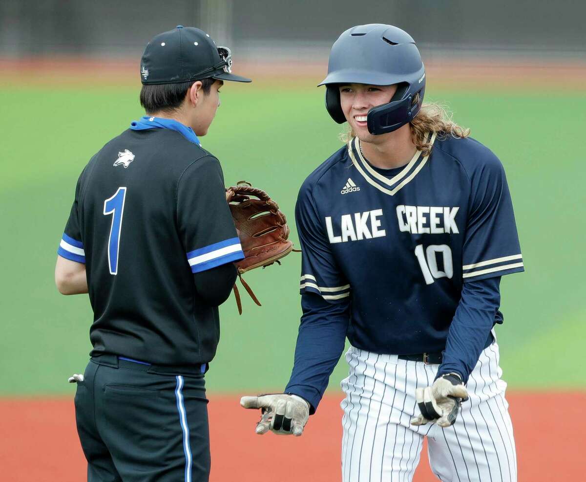 Samson Pugh #10 of Lake Creek reacts after advancing to third base following an error by Dekaney shortstop Mason Maxie in the first inning of a high school baseball game at Grand Oaks High School, Friday, March 11, 2022, in Spring.