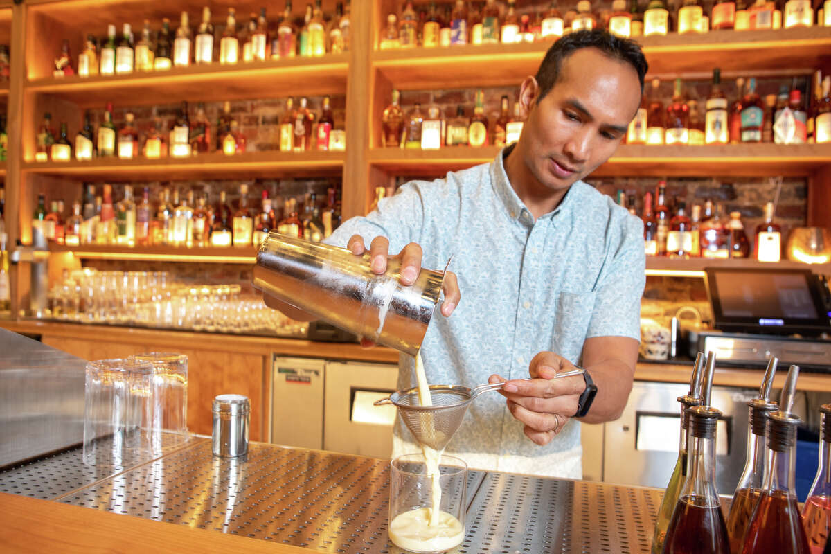 Owner Kevin Diedrich pours one of his signature Thrilla in Manila cocktails at Pacific Cocktail Haven in San Francisco, Calif. on Mar. 11, 2022.