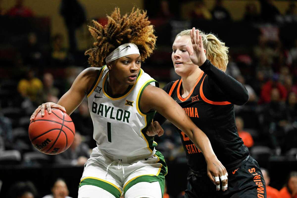Baylor’s NaLyssa Smith, front, works against Oklahoma State’s Abbie Winchester. The East Central product scored 15 points, 10 rebounds, two blocks and two steals.