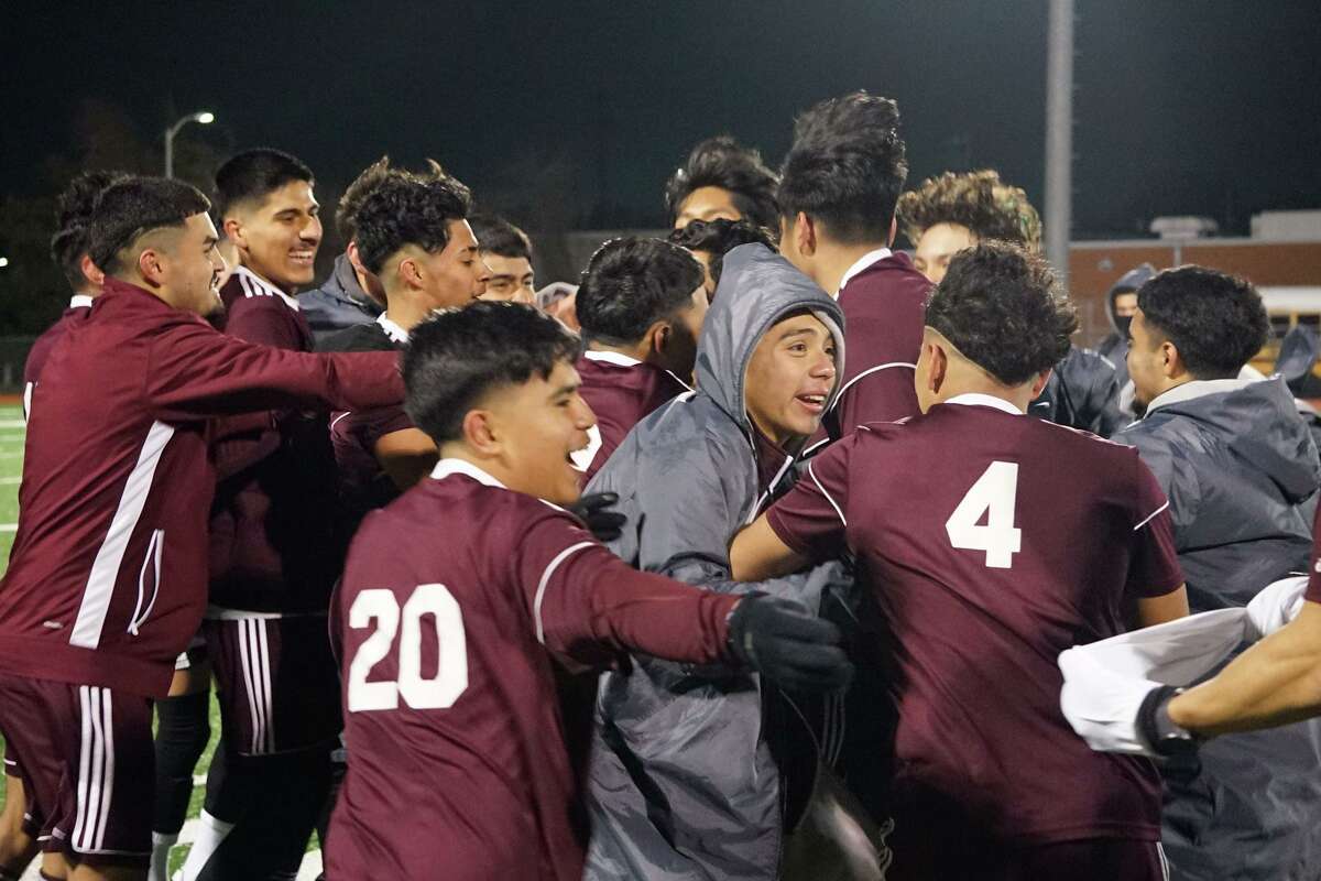 The players on the Northbrook boys soccer team mob each other after beating Stratford 4-2 in the regular season finale at home on March 11, clinching the program's first playoff berth in seven seasons